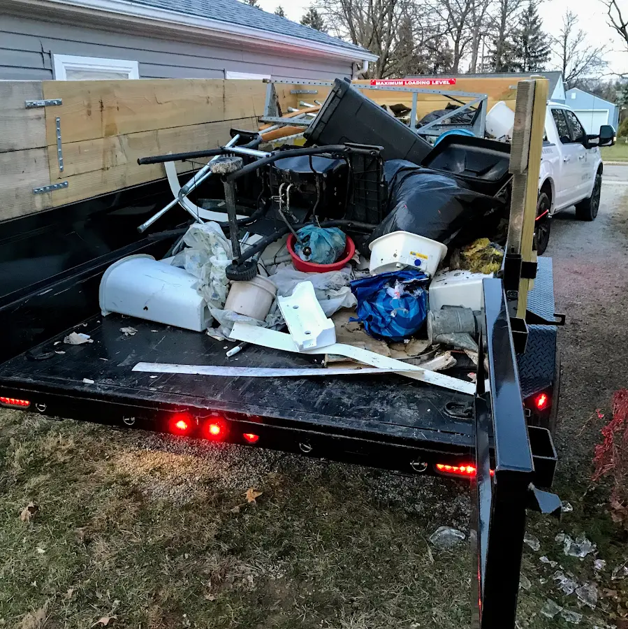 Roll-off dumpster delivered to a residential driveway in Center